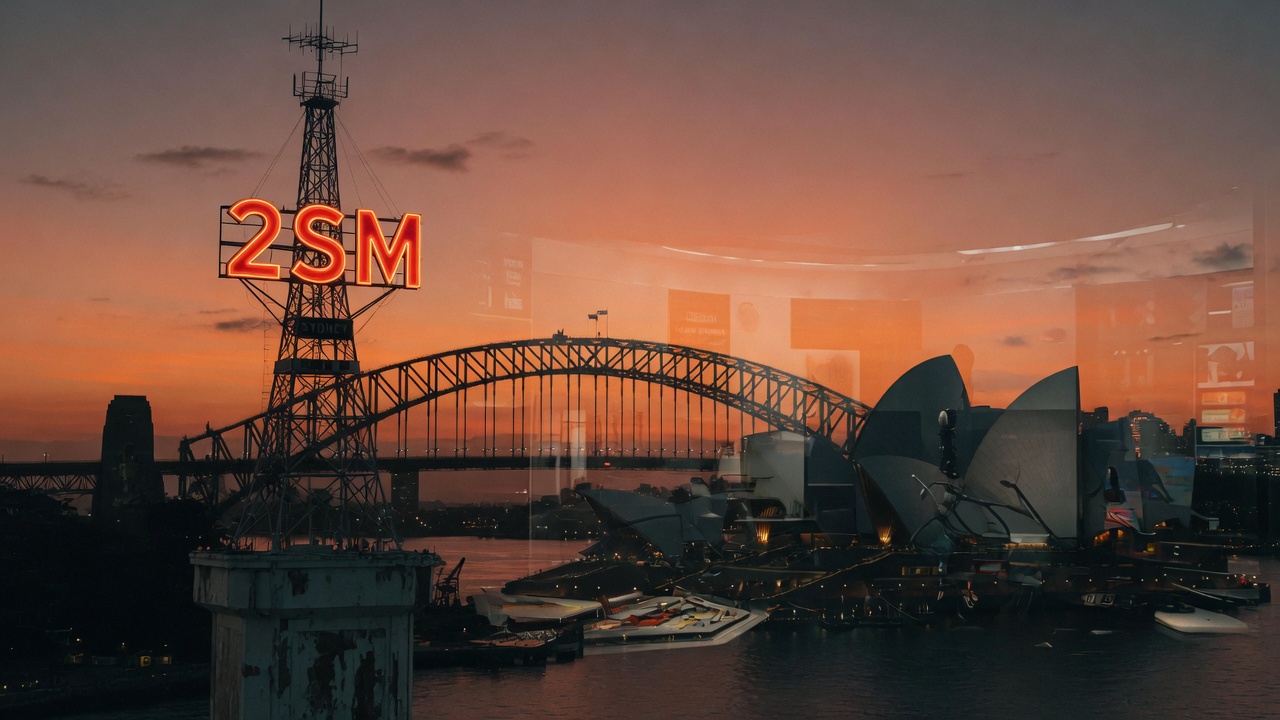 Sydney Harbour at dusk with a vintage radio tower and modern studio reflection, representing 2SM's nearly century-long history