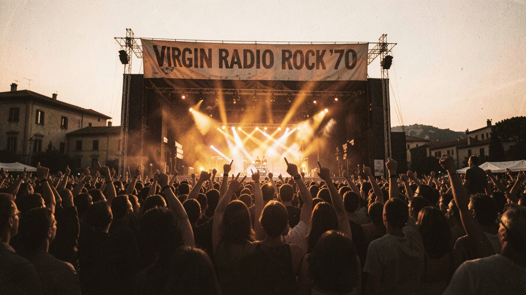 An outdoor 1970s Italian rock concert crowd at dusk beneath a stage banner reading Virgin Radio Rock '70