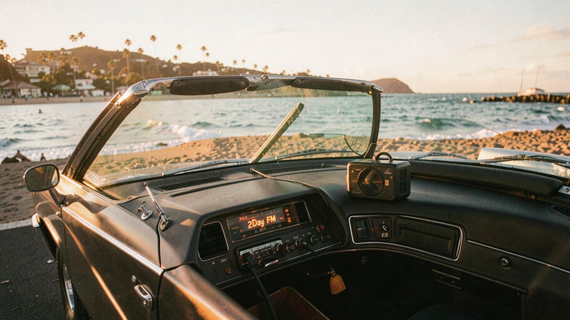 A retro 1980 Sydney beach scene at golden hour with a vintage convertible car near Bondi Beach