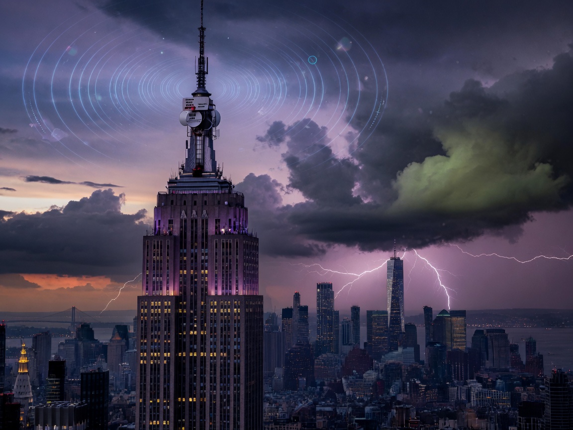 The Empire State Building at dusk with a weather radio antenna and storm clouds rolling over Manhattan