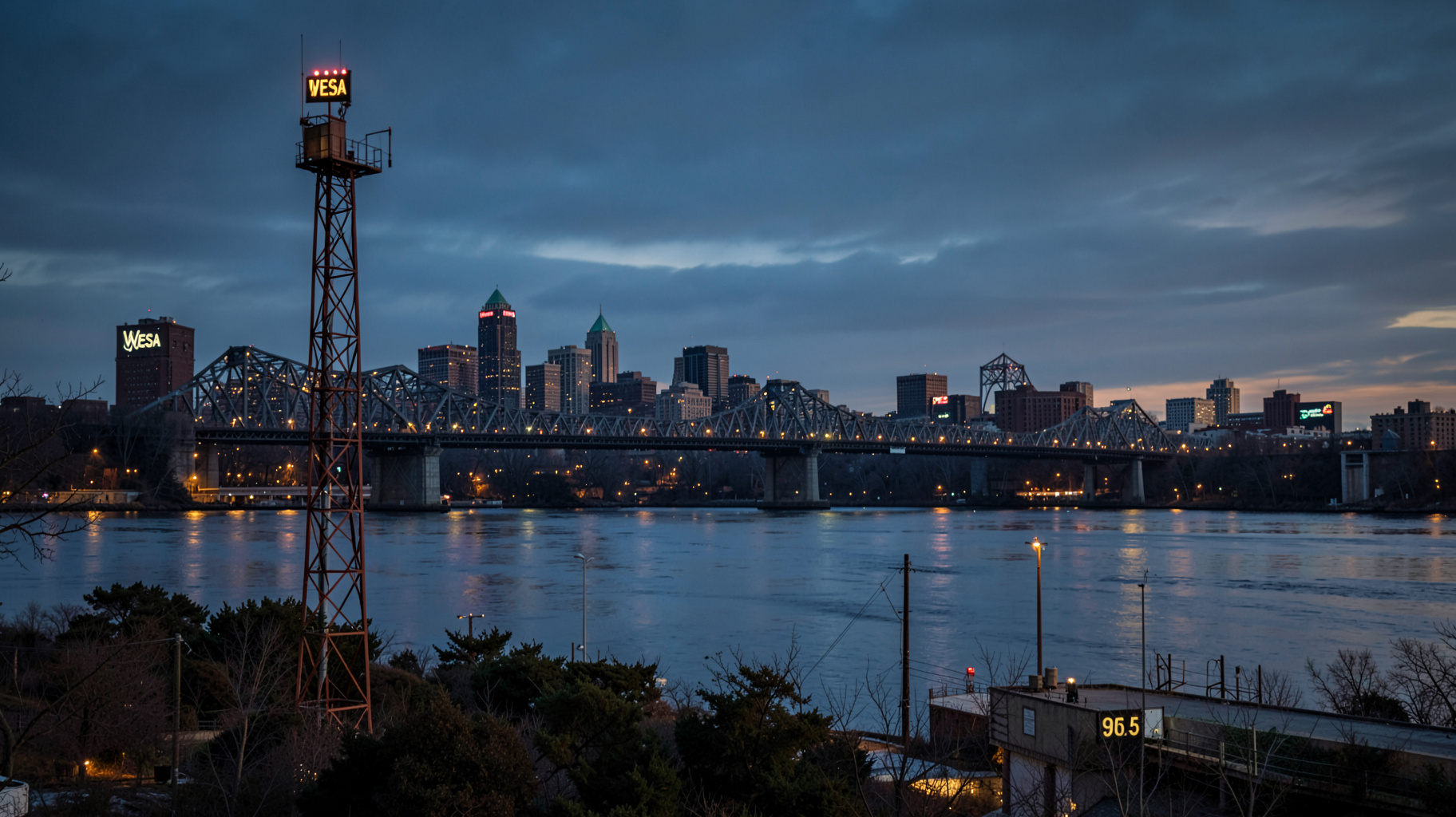 Pittsburgh skyline at dusk with a glowing radio tower reading WESA 90.5
