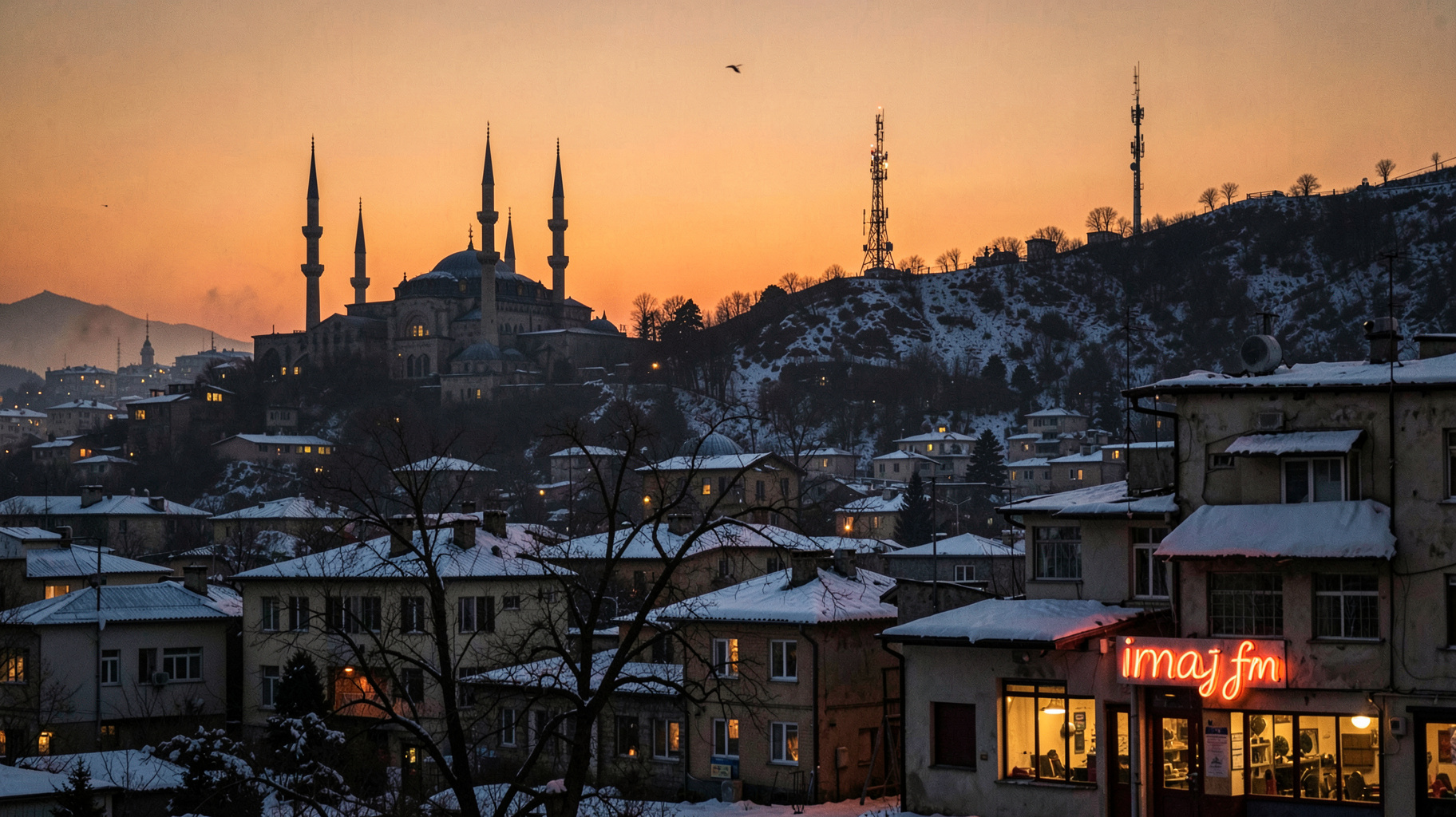 A snow-dusted Erzurum skyline at dusk with the Çifte Minareli Medrese silhouetted against the sky
