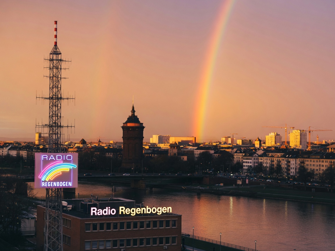 Mannheim skyline with a rainbow evoking Radio Regenbogen