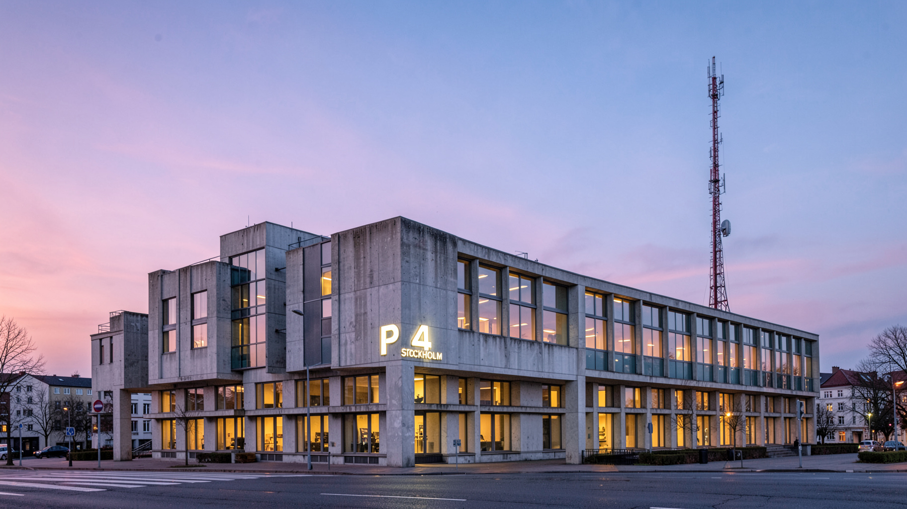 The modernist Radiohuset broadcasting house in Stockholm at dusk with a sign reading P4 Stockholm