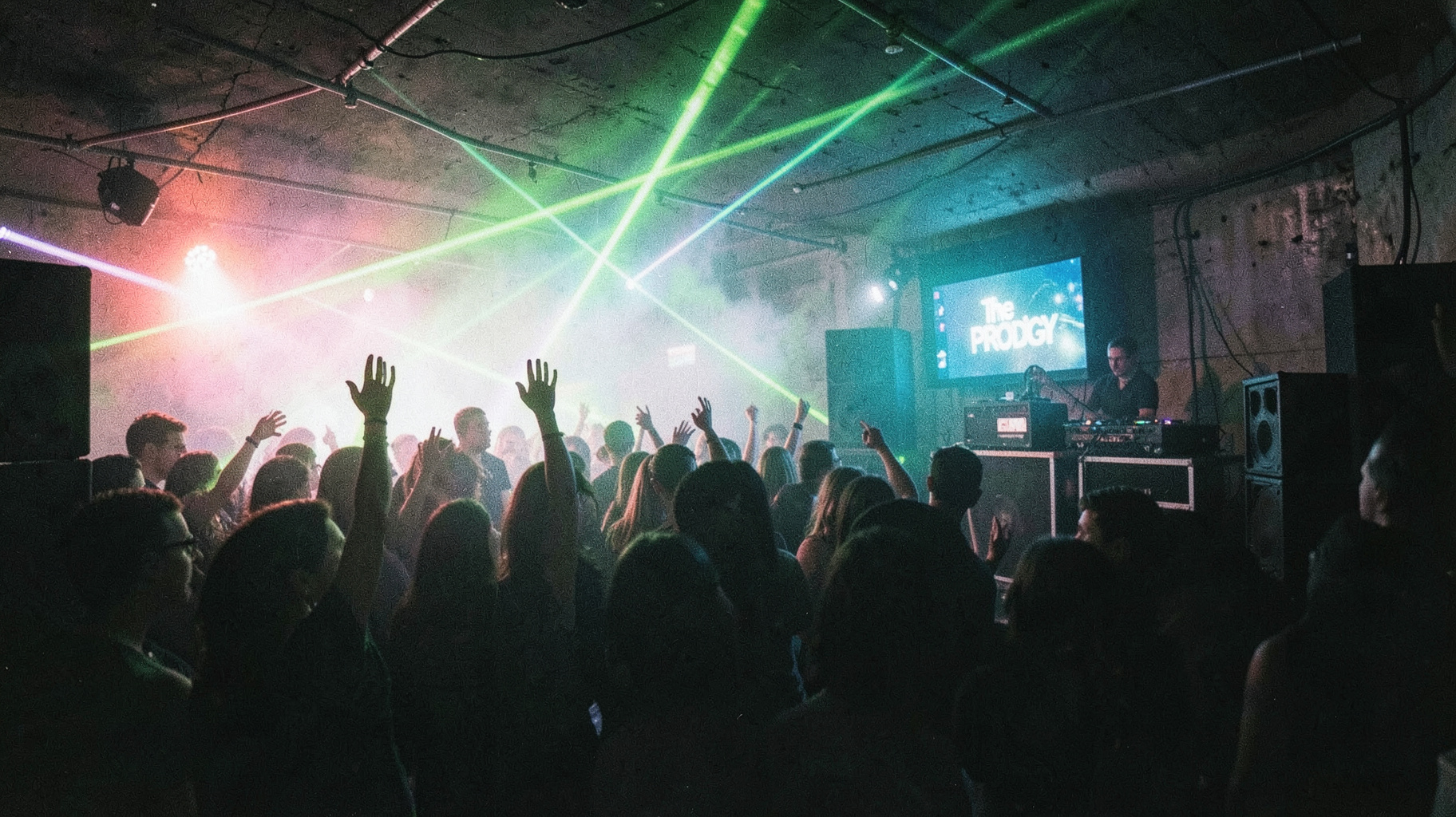 A packed 1990s Essex warehouse rave with lasers and a screen reading The Prodigy