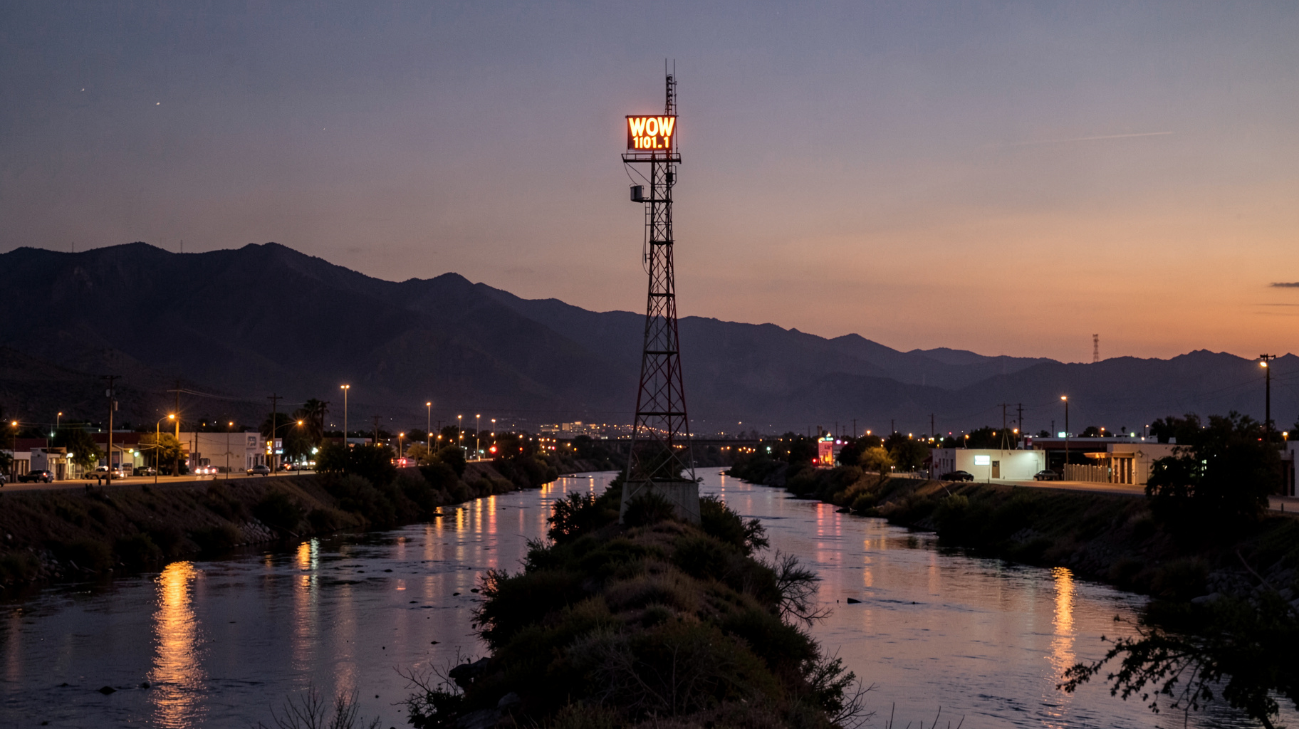 Twilight over the Nazas River between Torreón and Gómez Palacio with a radio tower reading WOW 101.1