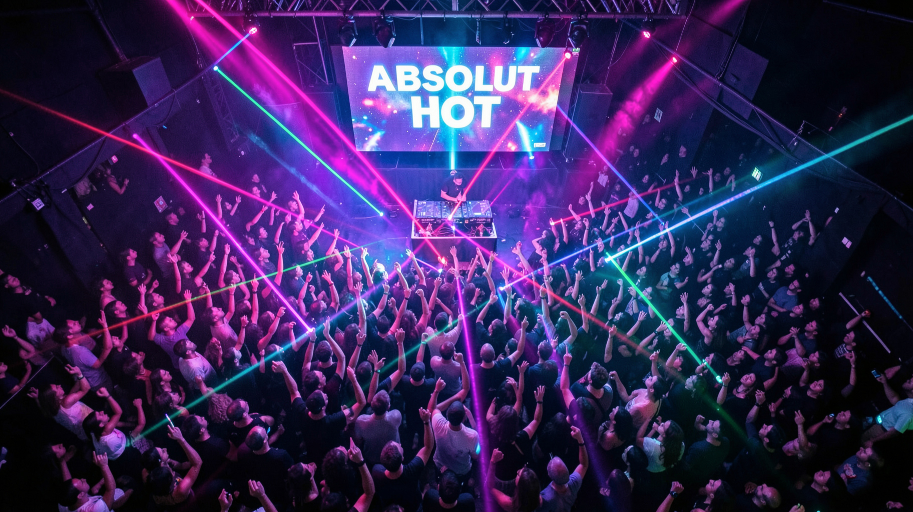 Packed nightclub dance floor with an LED screen reading Absolut Hot above the DJ booth