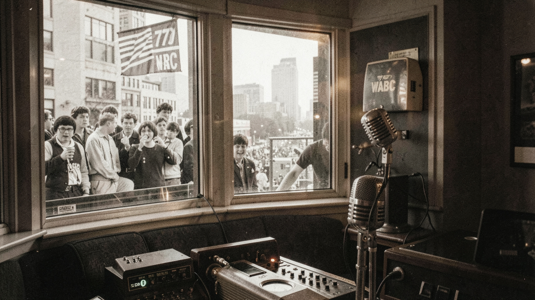 A vintage 1964 New York radio studio with a 770 WABC microphone flag overlooking the Beatlemania crowds