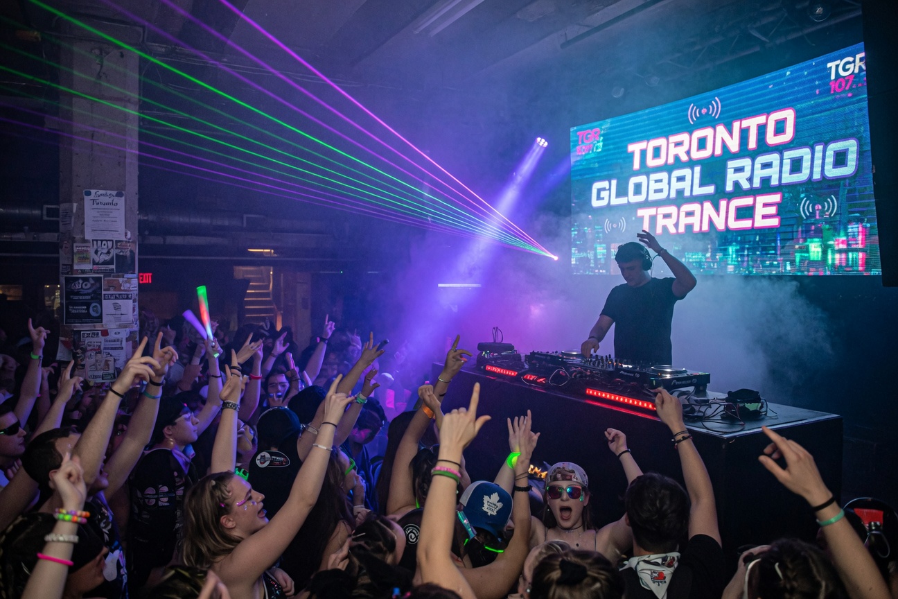 Underground trance club in Toronto with laser beams, fog, DJ booth and Toronto Global Radio Trance LED display